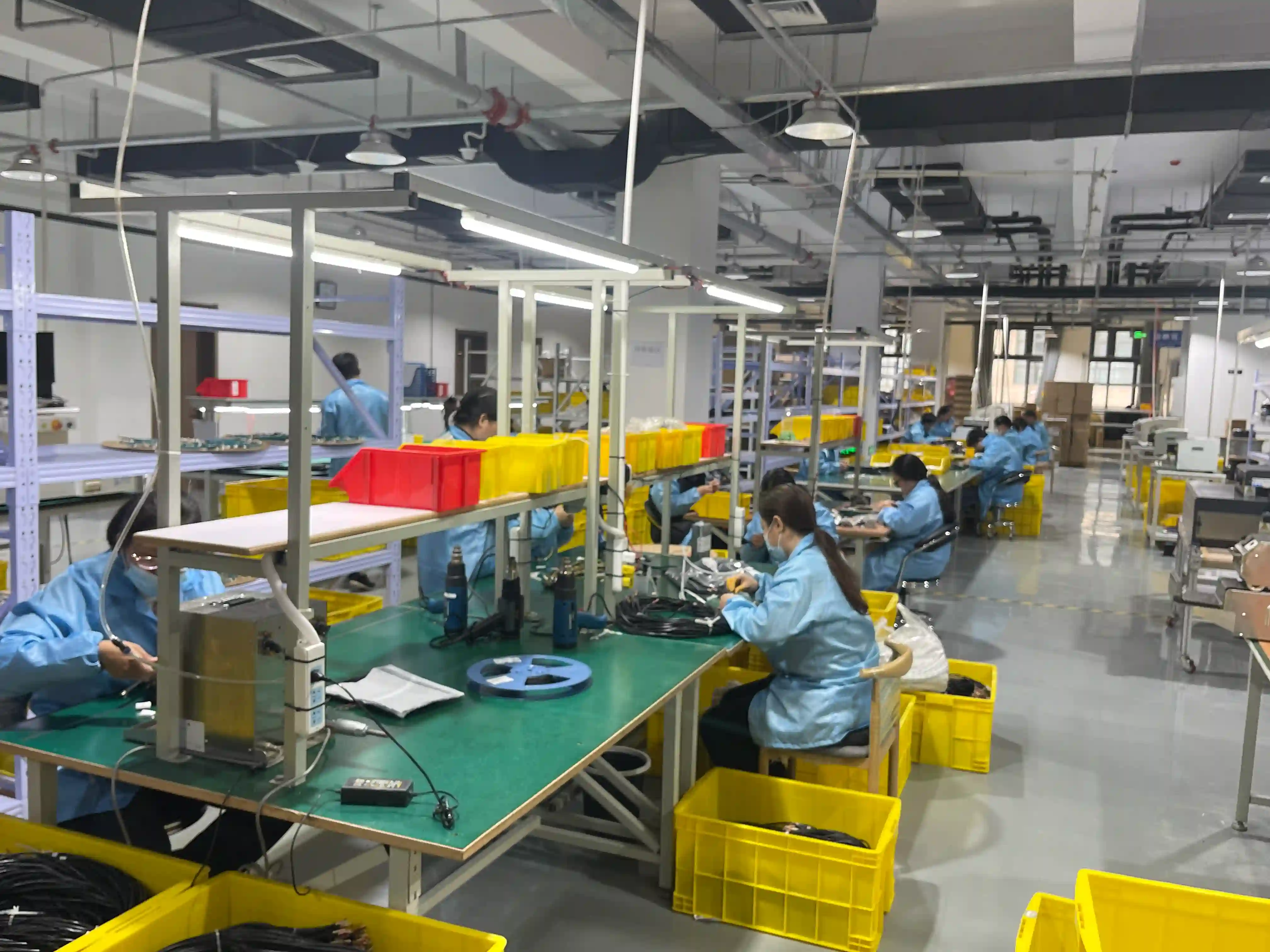 Wire harness contract manufacturing facility with automated assembly equipment