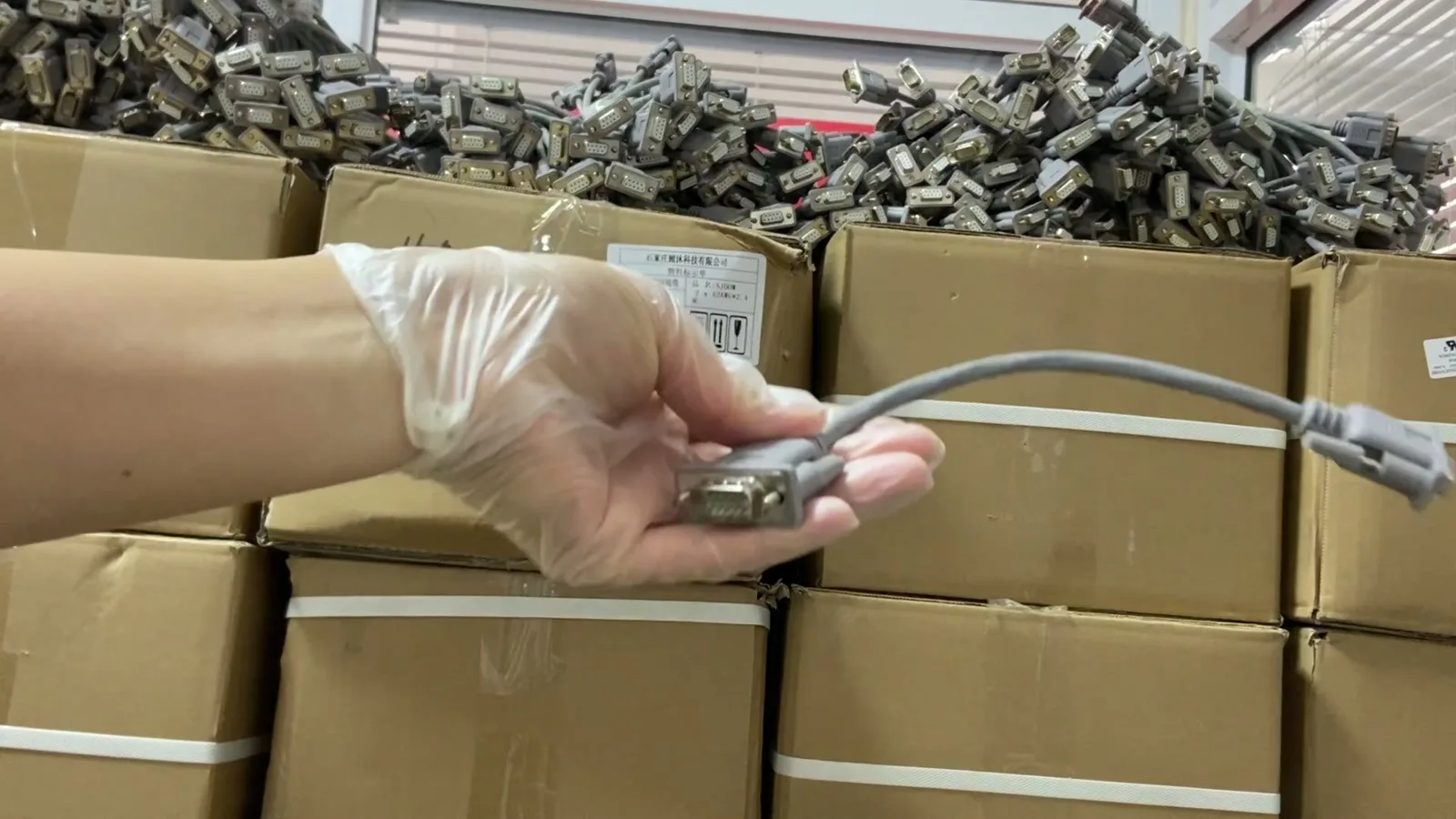 Bulk DB9 cable assembly production lots in our China warehouse before packout