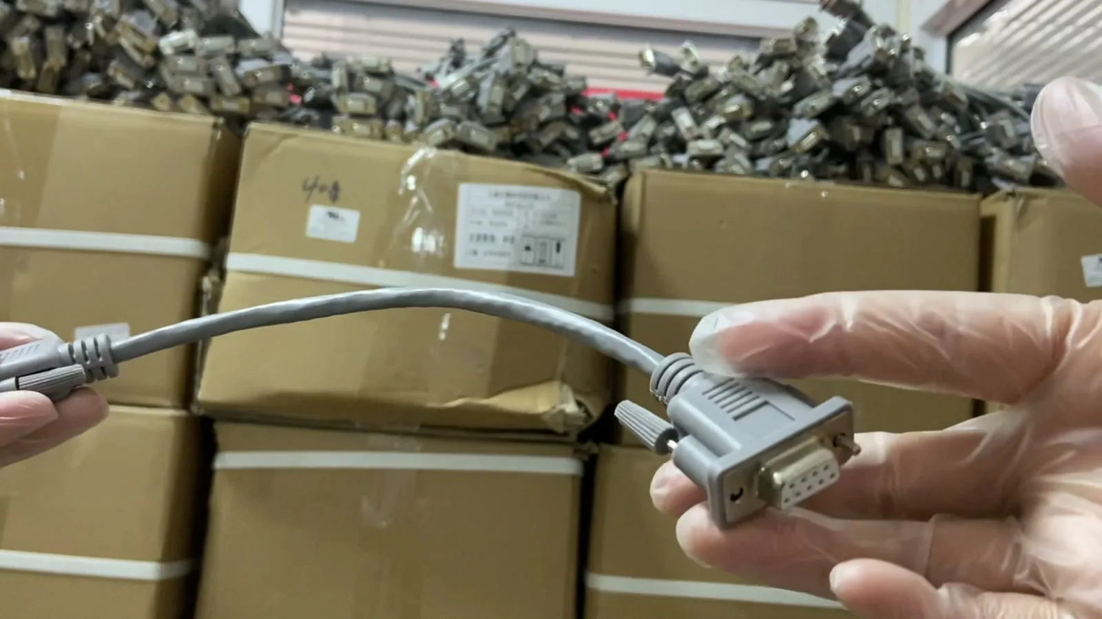 Gloved quality check of a DB9 cable assembly against released drawing