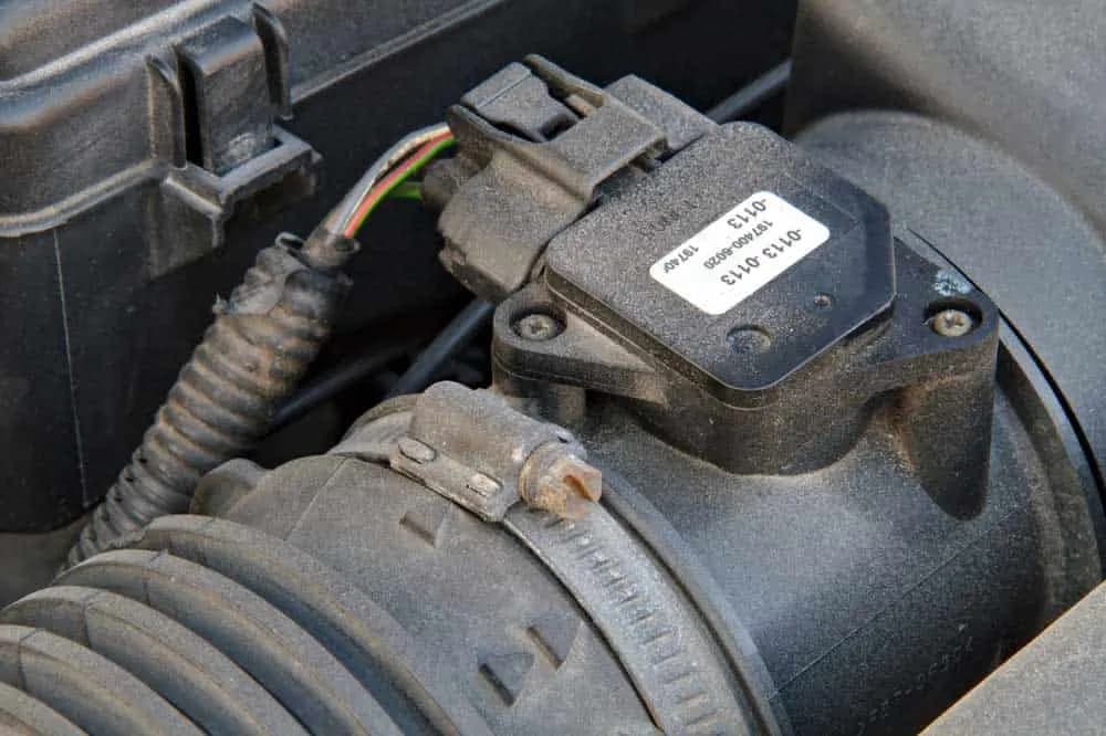 Engine sensor wiring harness for mass airflow signal transmission