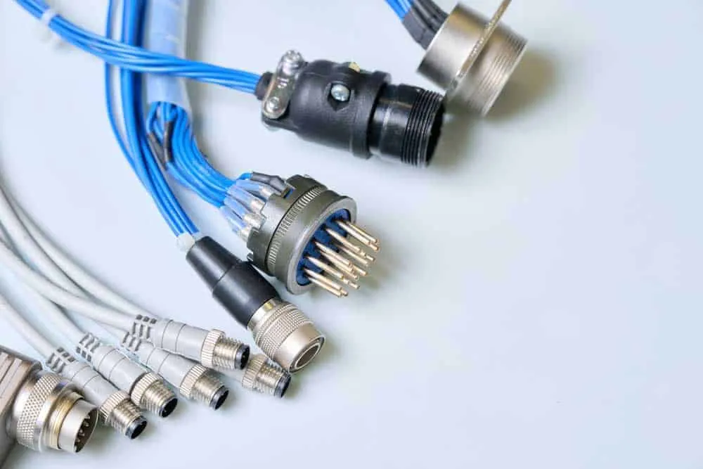 Pre-overmolded cable assembly with connectors and exposed wires before molding