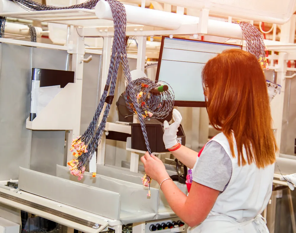 Automated wire harness testing station verifying continuity and insulation resistance